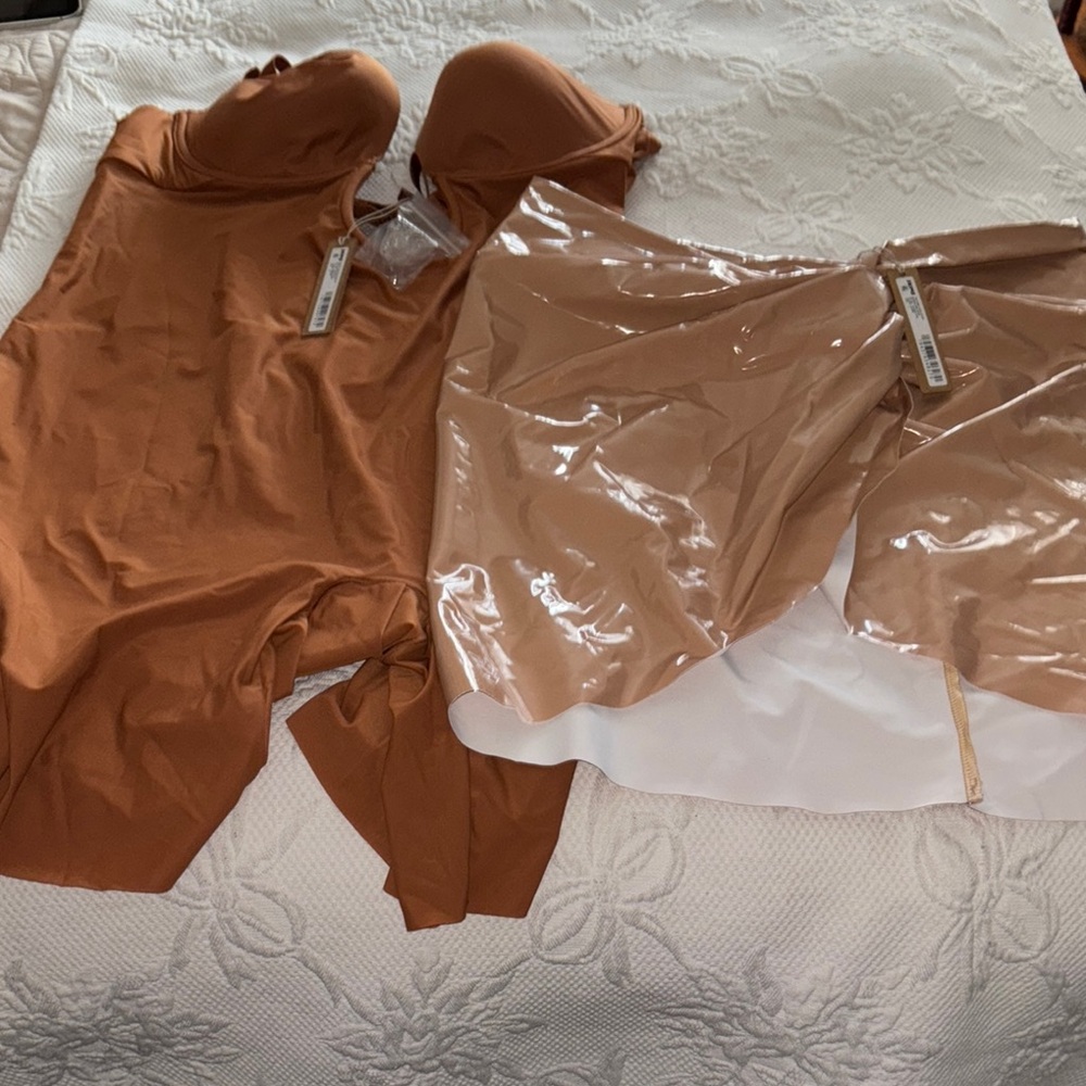 SKIMS Rust Bodysuit and patent leather skirt